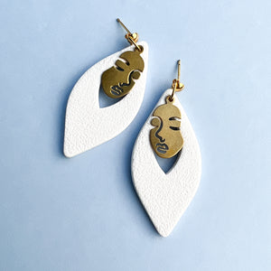 white-dangle-earrings-with-brass-faces